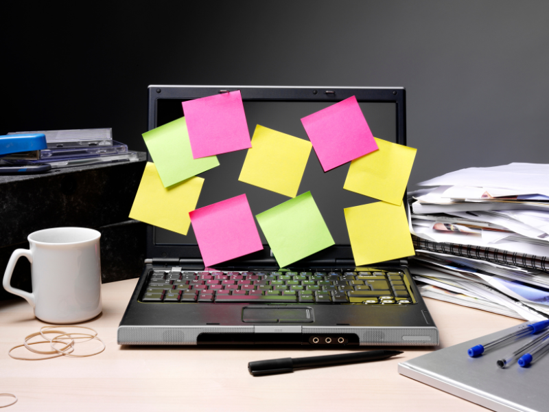 A laptop covered in post-it notes